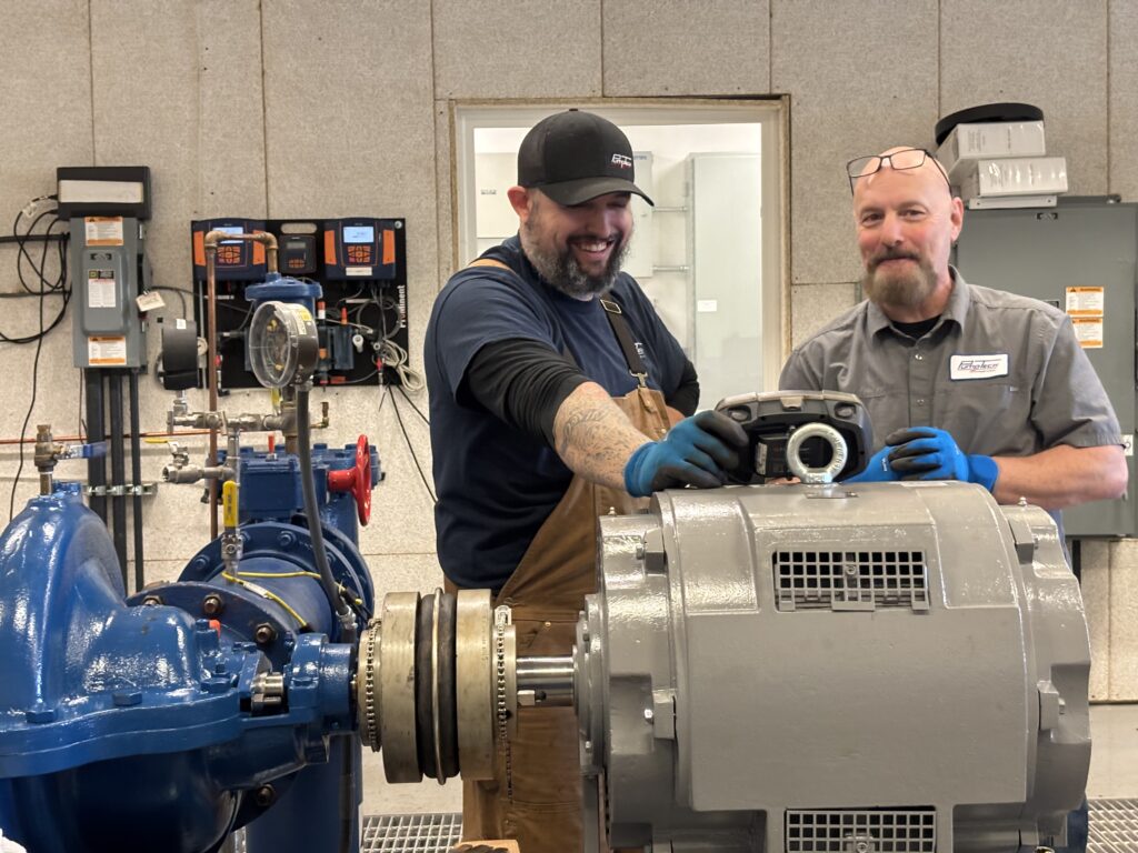 PumpTech Service Team Men with Instrumentation, Pump, and Motor